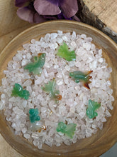 Load image into Gallery viewer, Multi colored agate fish in a bowl of rose quartz chips.